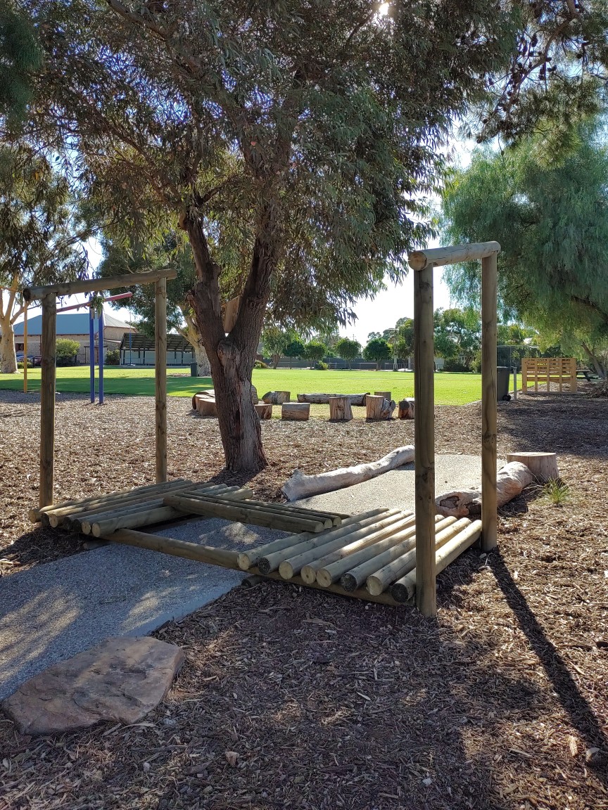 Photograph of nature play area with oval as backdrop