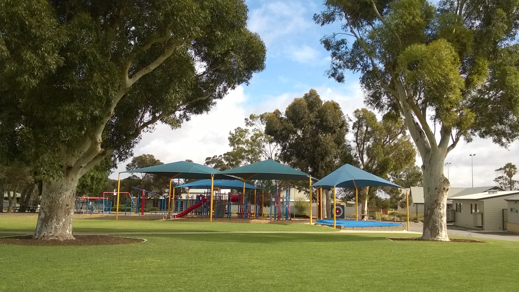 Photograph of play equipment with oval in the foreground