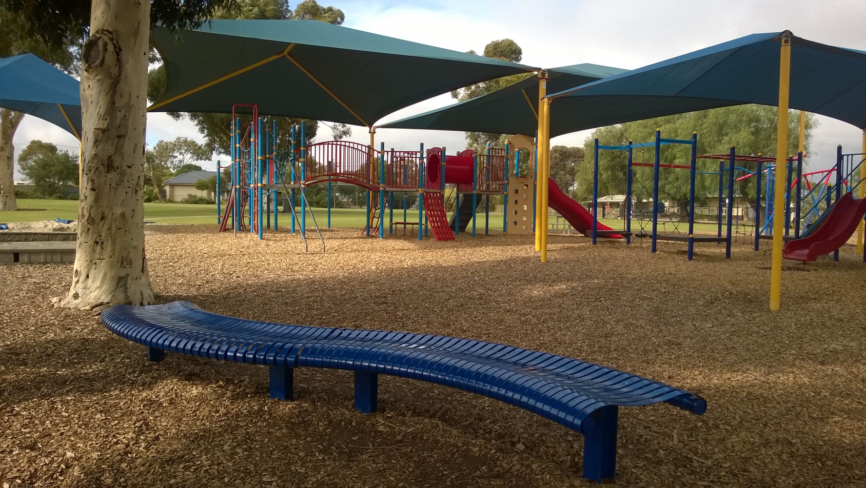 Photograph of playground and friendship bench